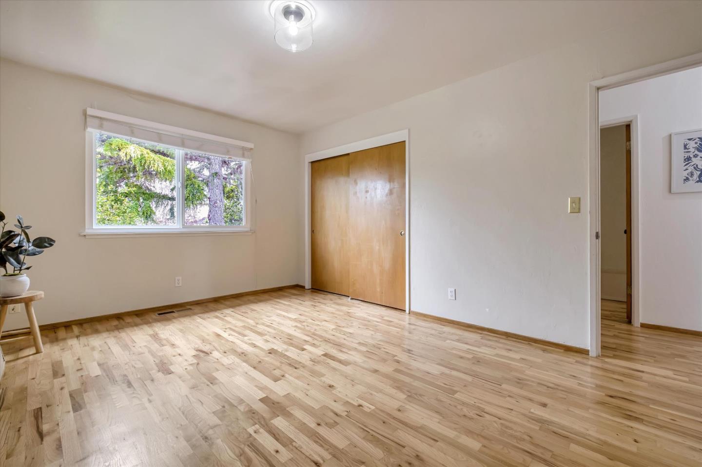 722 Seacliff Drive Aptos, CA 95003 - Photo 31 of 51 a view of an empty room with wooden floor and a window
