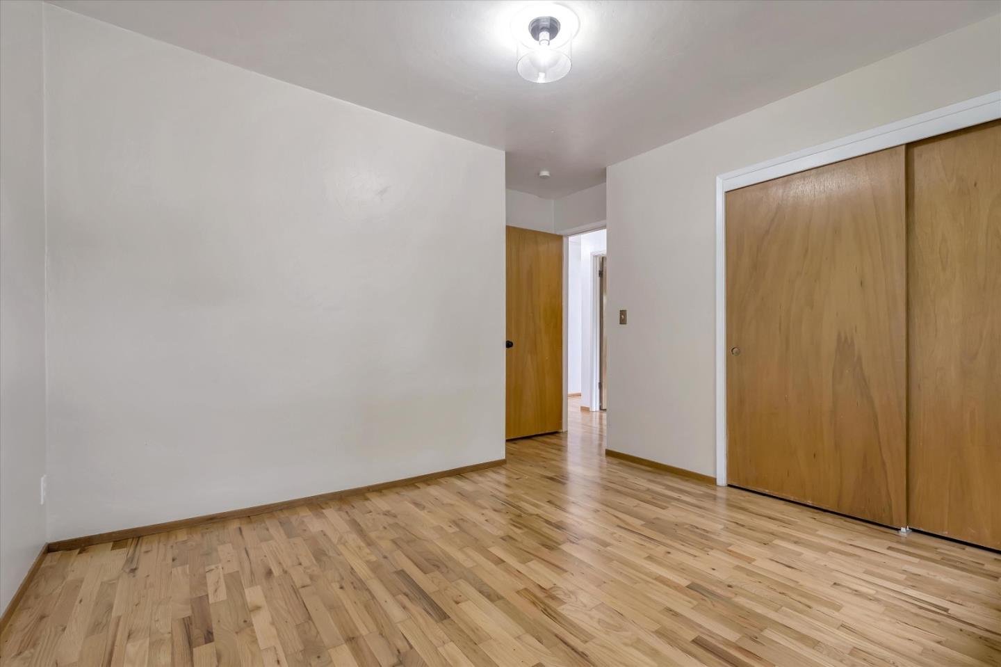 722 Seacliff Drive Aptos, CA 95003 - Photo 34 of 51 a view of an empty room with wooden floor