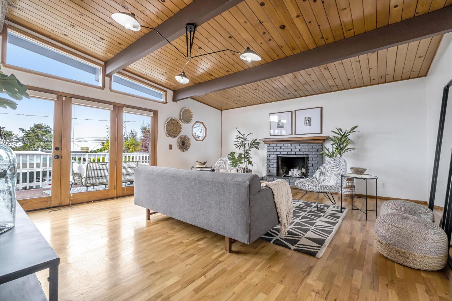 722 Seacliff Drive Aptos, CA 95003 - Photo 7 of 51 a living room with furniture a fireplace and a large window