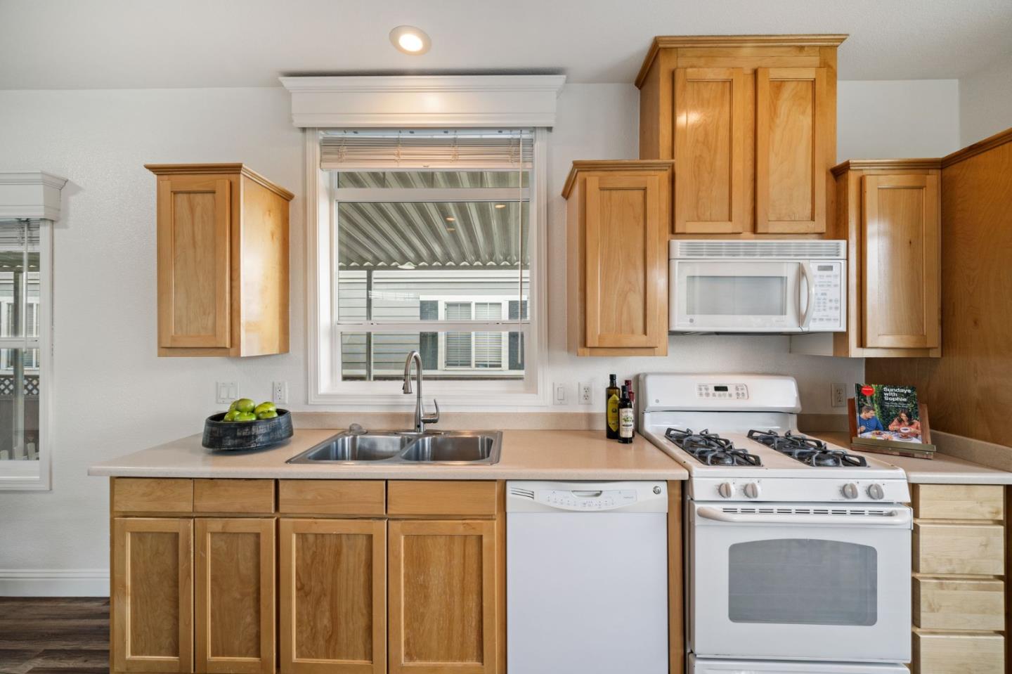 6130 Monterey Road, Unit 189 San Jose, CA 95138 - Photo 18 of 42 a kitchen with stainless steel appliances a white cabinets and a granite counter tops