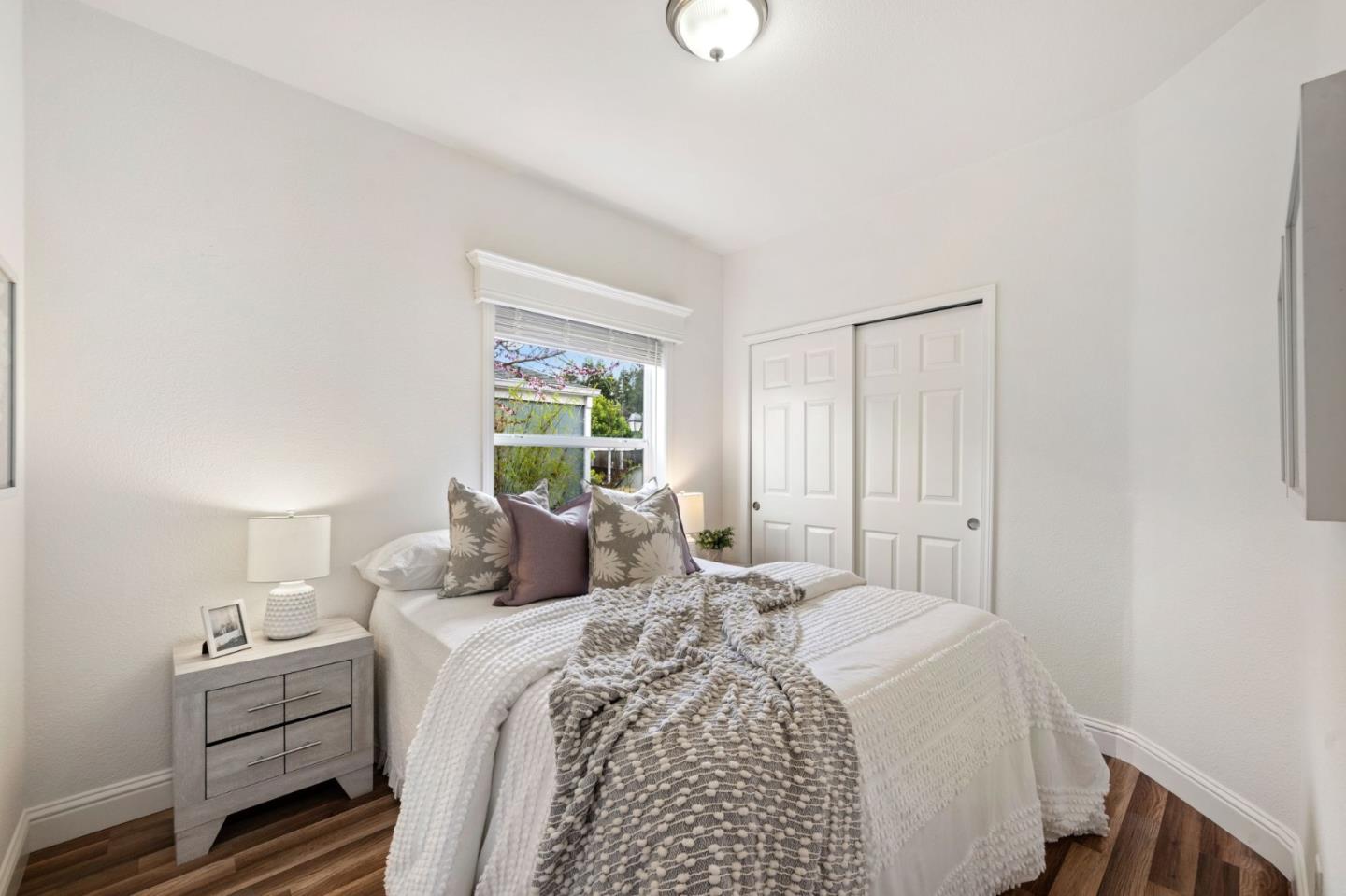 6130 Monterey Road, Unit 189 San Jose, CA 95138 - Photo 23 of 42 a bedroom with a bed and a window