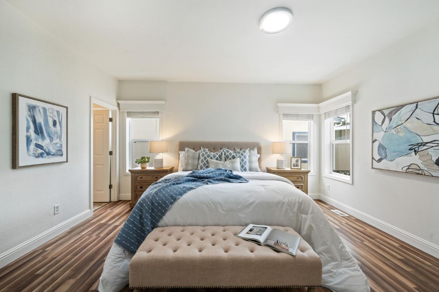 6130 Monterey Road, Unit 189 San Jose, CA 95138 - Photo 24 of 42 a bedroom with a large bed and painting on the wall