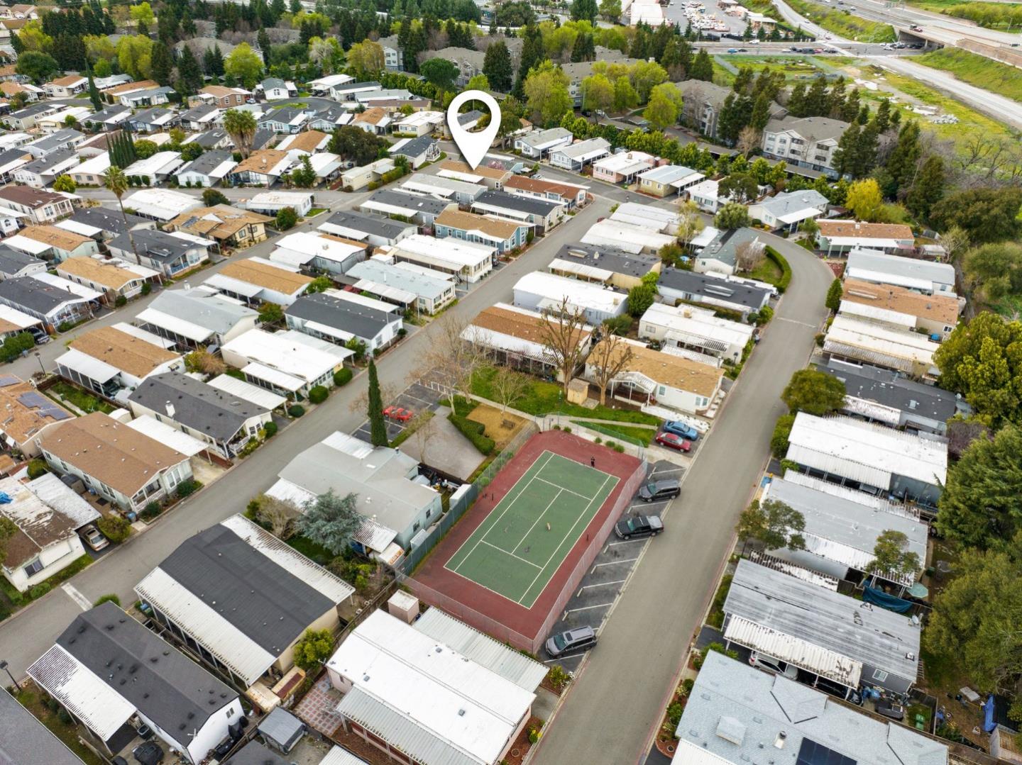 6130 Monterey Road, Unit 189 San Jose, CA 95138 - Photo 38 of 42 an aerial view of a residential apartment building with a yard