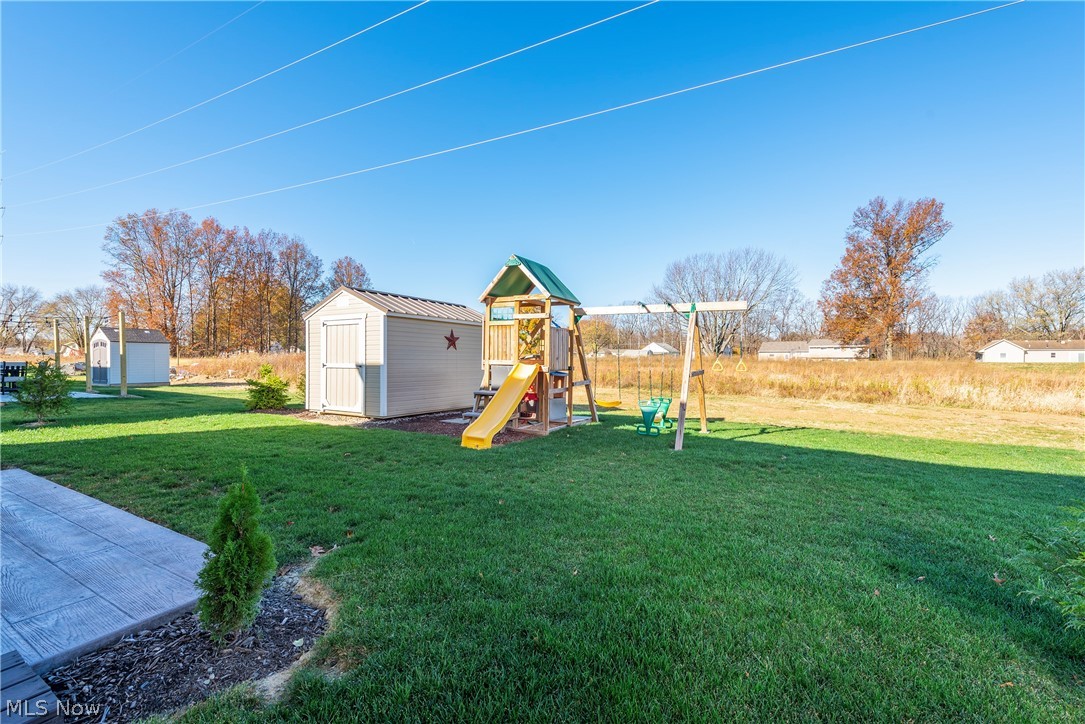 147 Springvale Drive Amherst, OH 44001 - Photo 17 of 19 Newer shed with metal roof