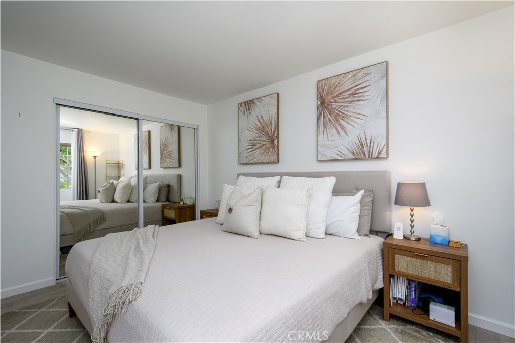 628 Daisy Avenue, Unit 222 Long Beach, CA 90802 - Photo 11 of 25 a bedroom with bed and night stand