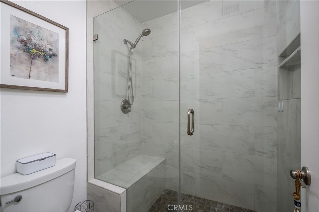 628 Daisy Avenue, Unit 222 Long Beach, CA 90802 - Photo 14 of 25 a bathroom with a shower a toilet and a sink