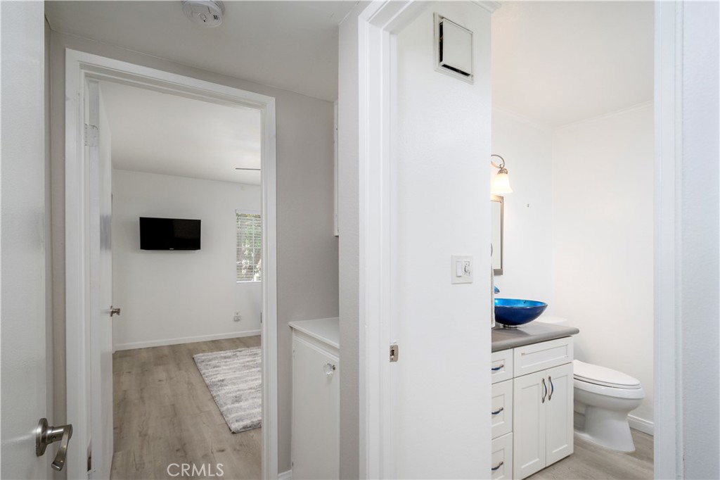 628 Daisy Avenue, Unit 222 Long Beach, CA 90802 - Photo 17 of 25 a bathroom with a sink toilet and mirror