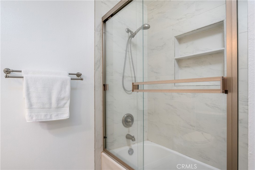 628 Daisy Avenue, Unit 222 Long Beach, CA 90802 - Photo 19 of 25 a bathroom with a glass shower door