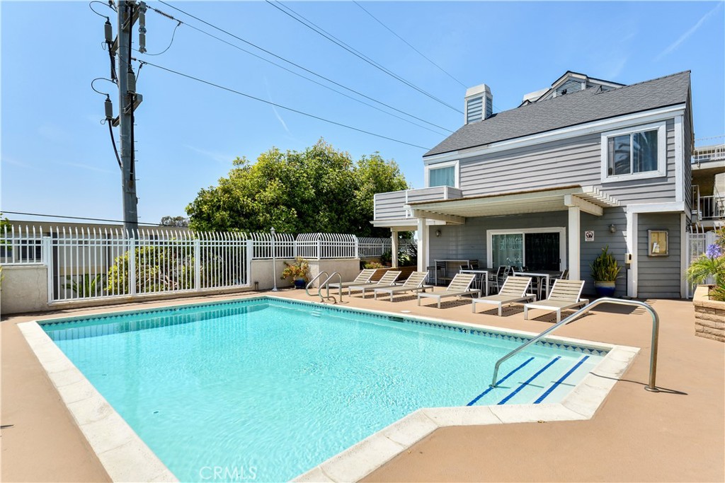 628 Daisy Avenue, Unit 222 Long Beach, CA 90802 - Photo 22 of 25 a view of a house with pool and chairs