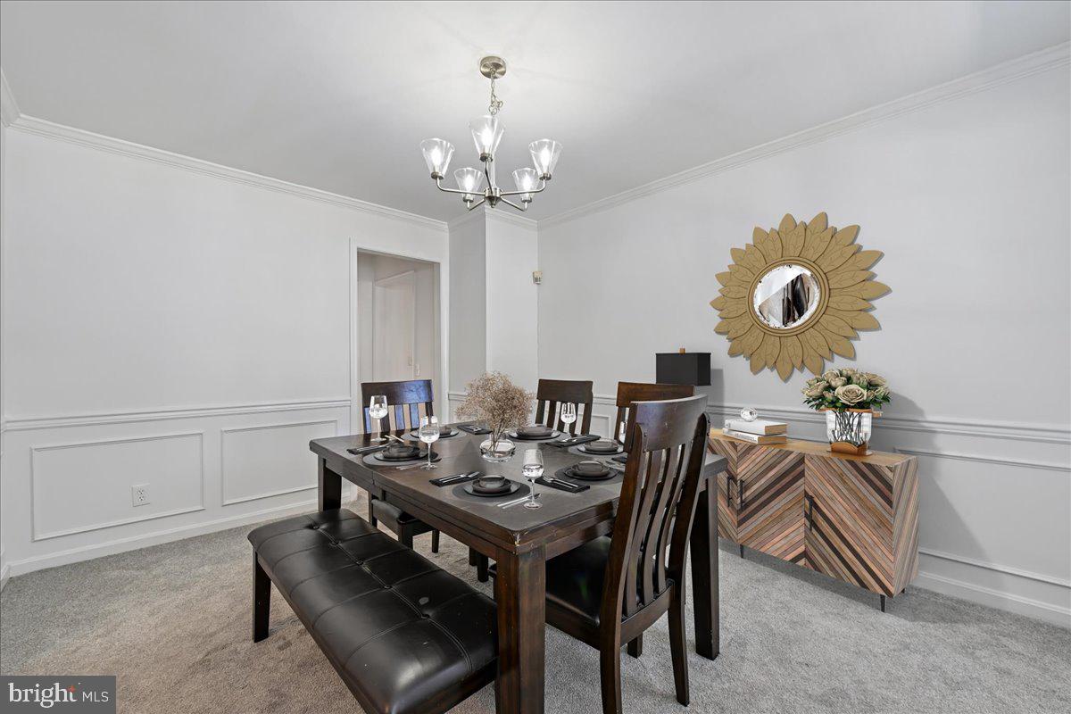 903 Brook Street Accokeek, MD 20607 - Photo 24 of 57 Dining Room with Chair Rail & Natural Light