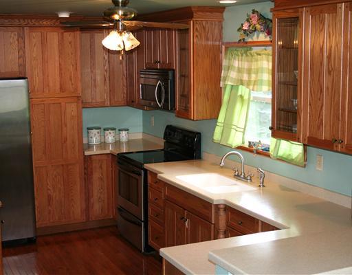 194 Noonen Street Rochester, PA 15074 - Photo 3 of 18 Kitchen. Large, nicely updated kitchen with Corian-type counters, solid oak cabs w/organizers, stainless steel appliances, breakfast bar.