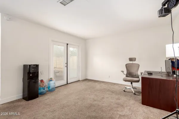 a workspace with furniture and a window