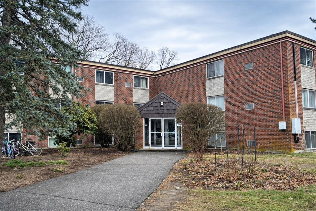 15 Weld Street, Unit 18 Framingham, MA 01702 - Photo 1 of 18 a front view of a house with garden