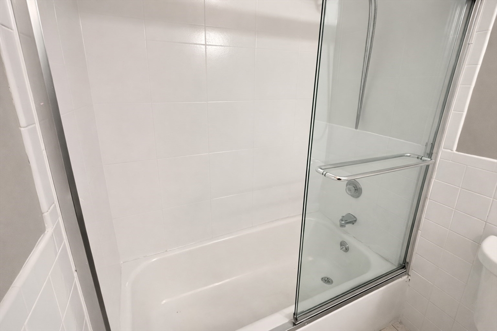15 Weld Street, Unit 18 Framingham, MA 01702 - Photo 14 of 18 a bathroom with a bathtub
