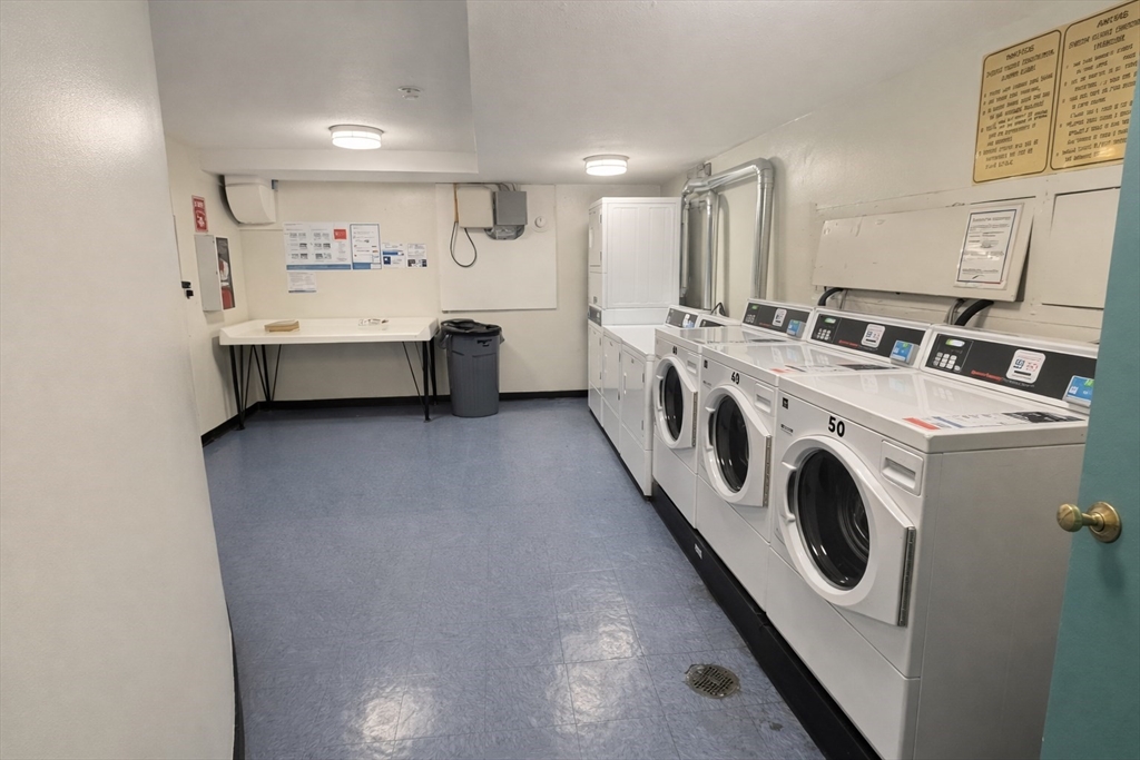 15 Weld Street, Unit 18 Framingham, MA 01702 - Photo 16 of 18 a view of washer and dryer with bathroom in the background