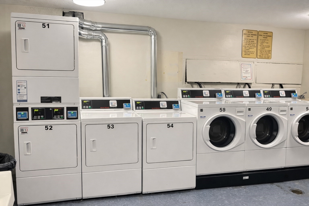 15 Weld Street, Unit 18 Framingham, MA 01702 - Photo 17 of 18 a utility room with dryer and washer