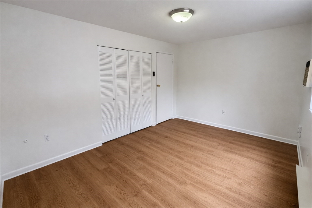 15 Weld Street, Unit 18 Framingham, MA 01702 - Photo 10 of 18 a view of empty room with wooden floor