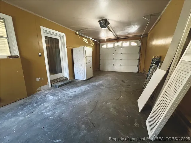 en empty room with windows and stairs