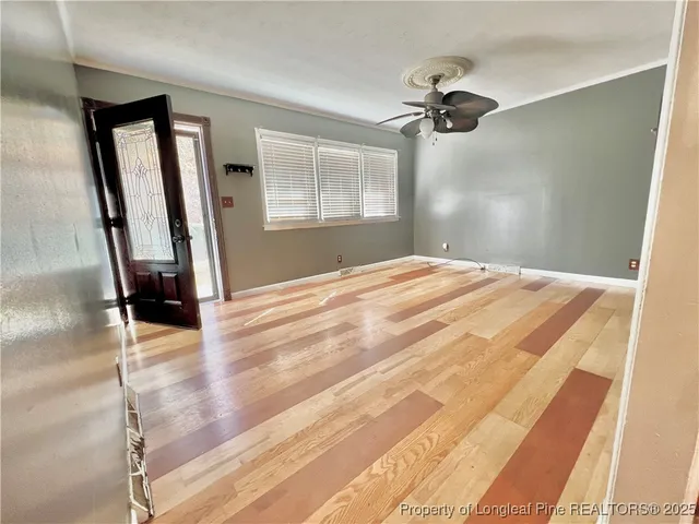 a bedroom with a bed and a mirror