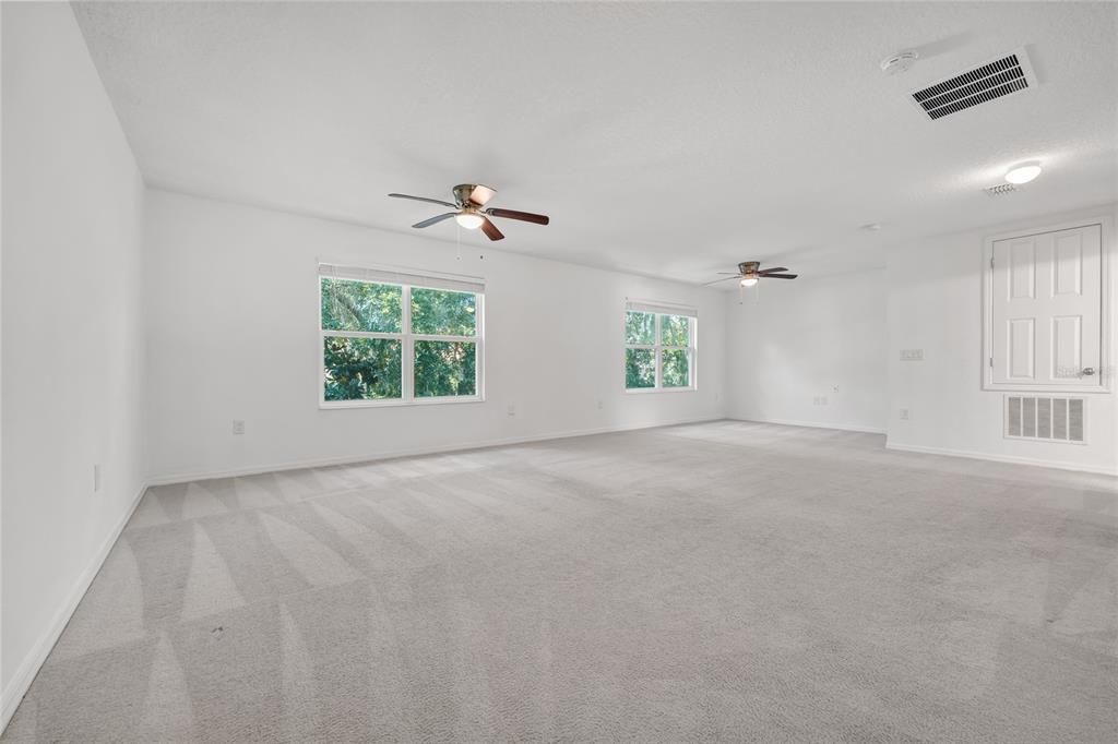 4824 Poolside Drive St. Cloud, FL 34769 - Photo 17 of 29 an empty room with windows
