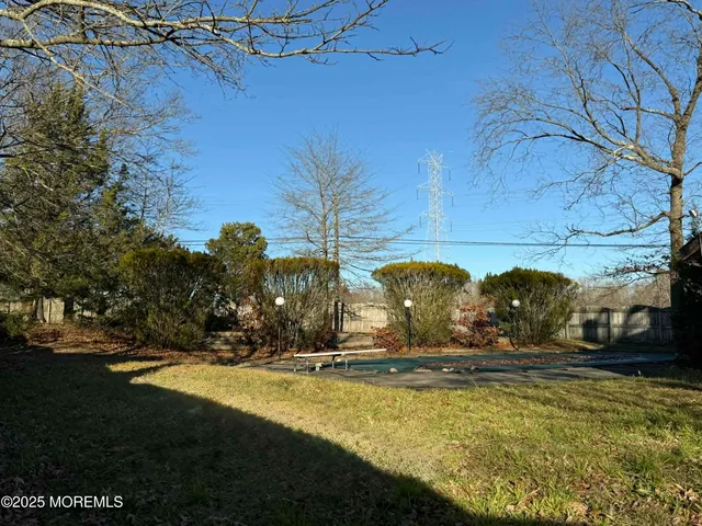 a view of swimming pool with a yard