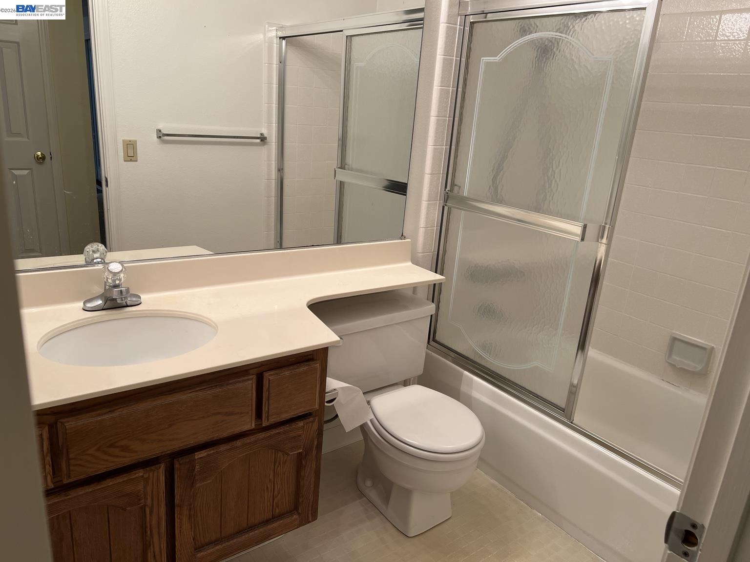 212 Puddingstone Road Alameda, CA 94502 - Photo 14 of 24 a bathroom with a sink a toilet a mirror and shower