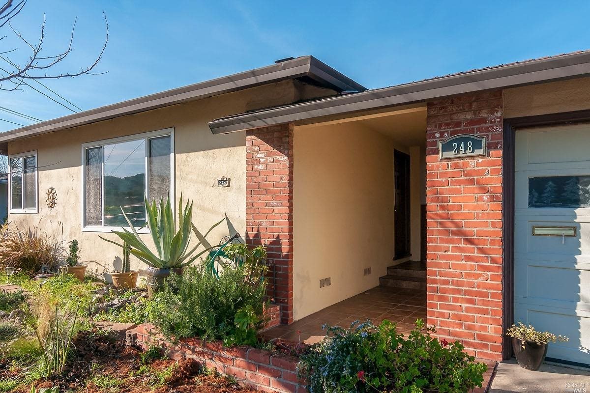 248 Orris Terrace San Rafael, CA 94903 - Photo 1 of 1 a view of a front door and wooden bench