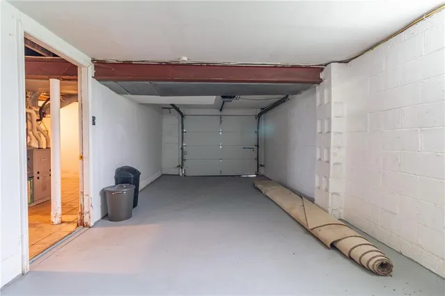 a view of a room with gym equipment and a large window