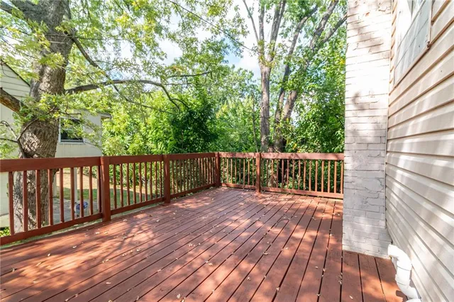 a view of deck with wooden floor and fence