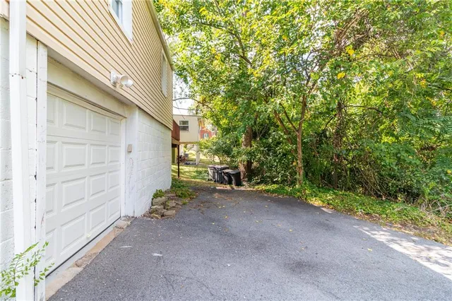 a view of a house with a backyard