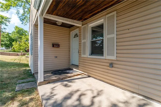 a view of house with backyard
