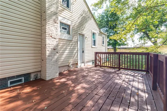 a view of backyard with a deck