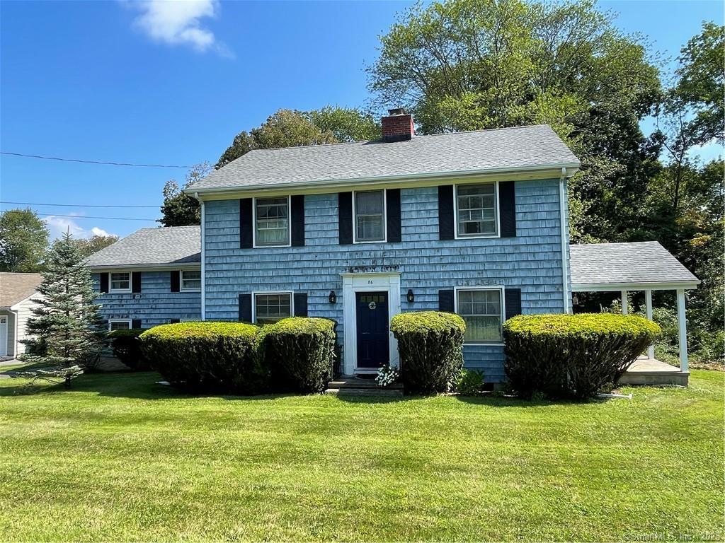 86 Soundview Road Ridgefield, CT 06877 - Photo 1 of 1 a front view of a house with a garden