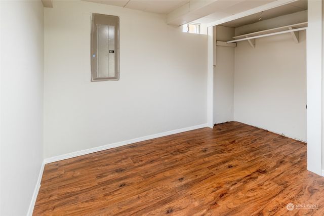 a bathroom with a toilet a sink and a mirror
