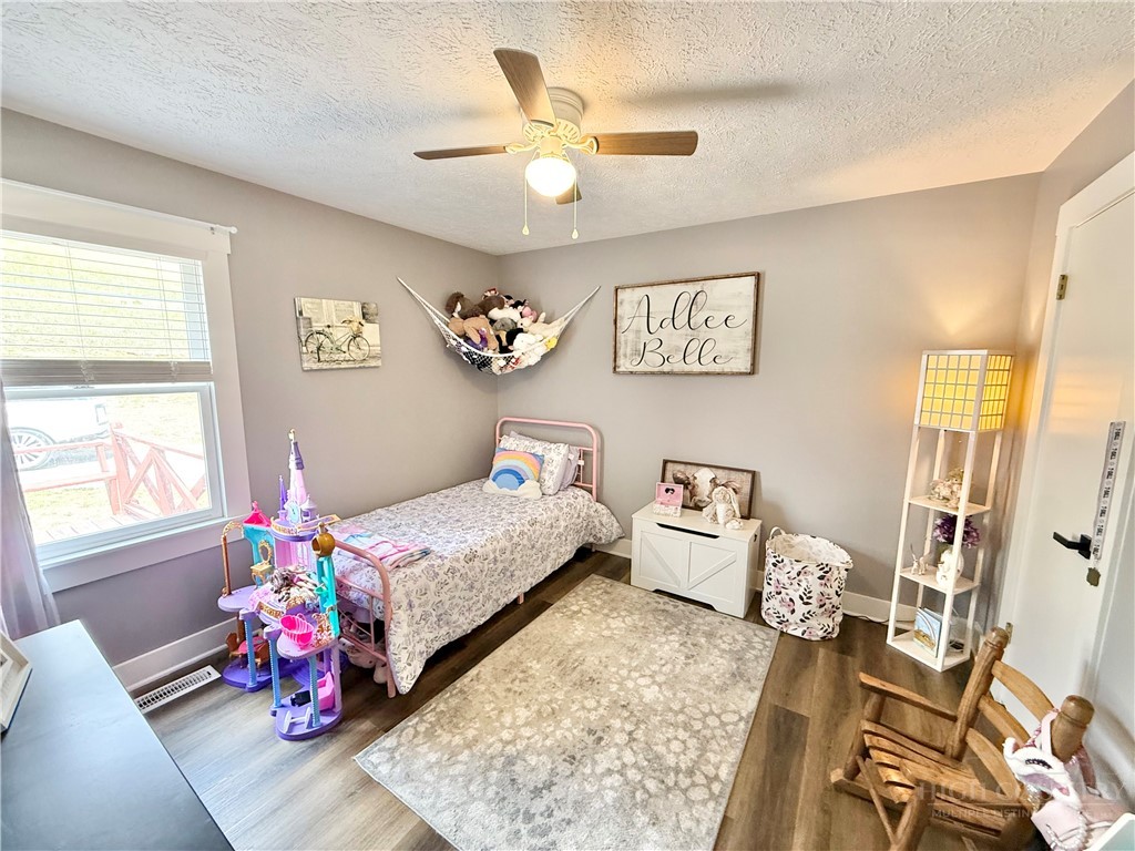 1315 Irwin Grocery Road Laurel Springs, NC 28644 - Photo 14 of 22 a bedroom with furniture and a chandelier