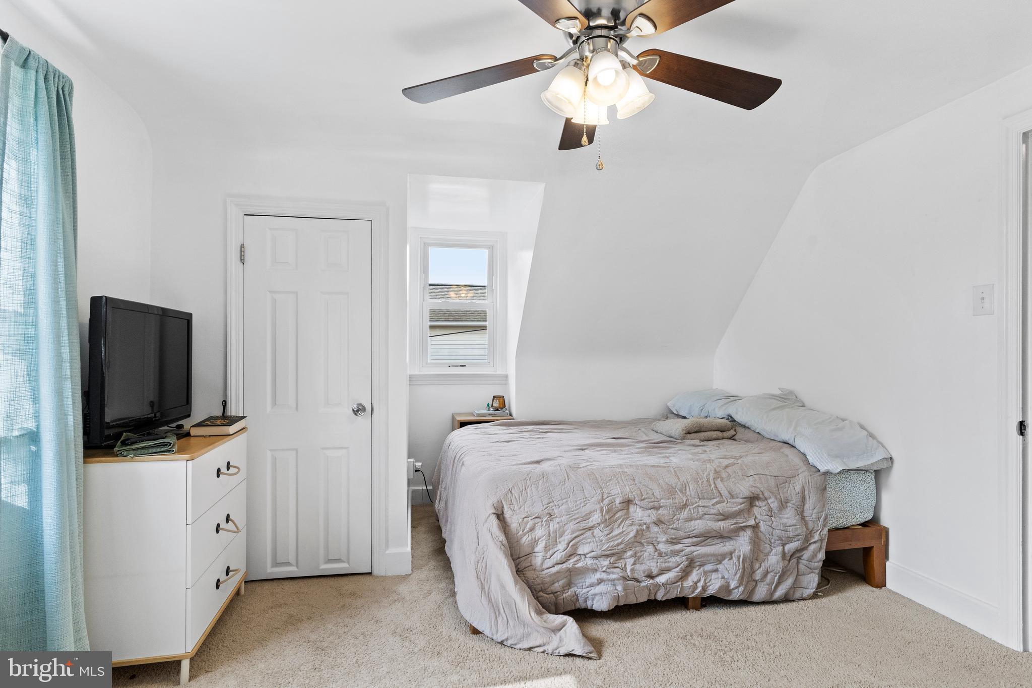 456 Edgehill Road York, PA 17403 - Photo 20 of 25 a bedroom with a bed and a flat tv screen on dresser