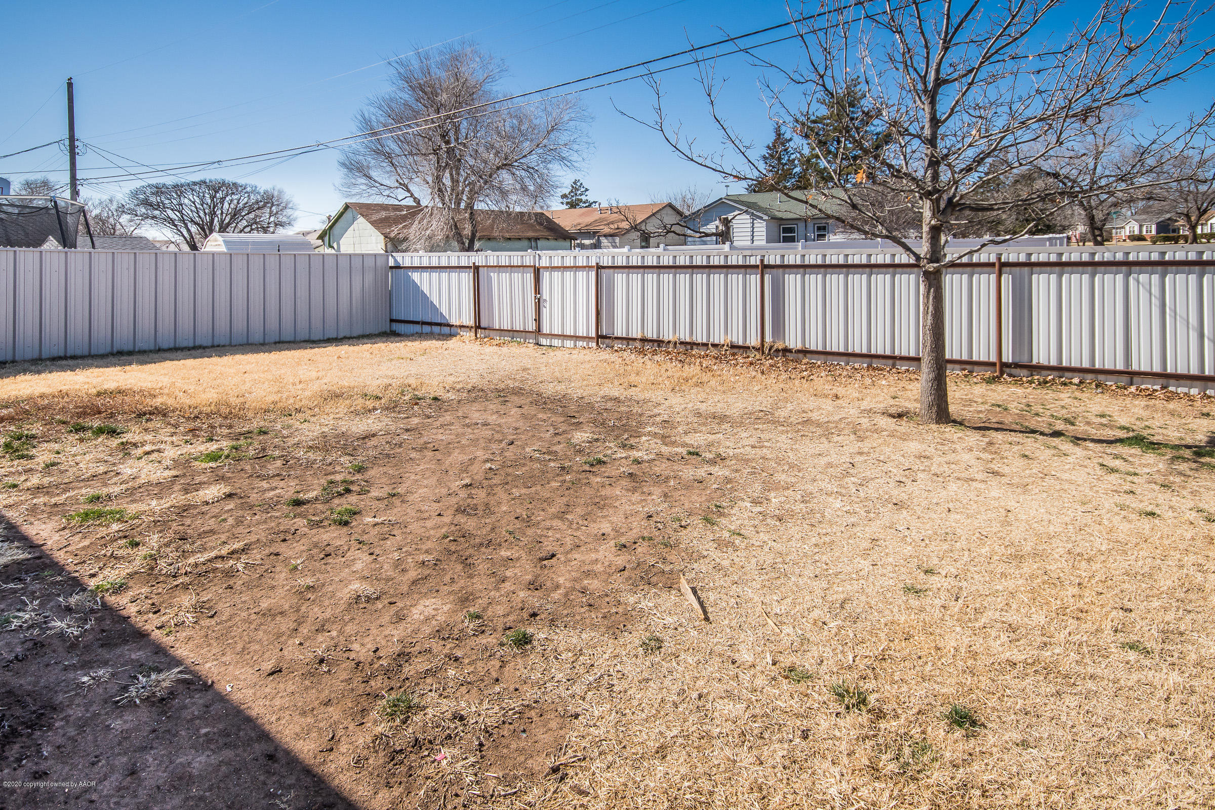 4812 Capulin Lane Amarillo, TX 79110 - Photo 18 of 20 a view of a yard with wooden fence