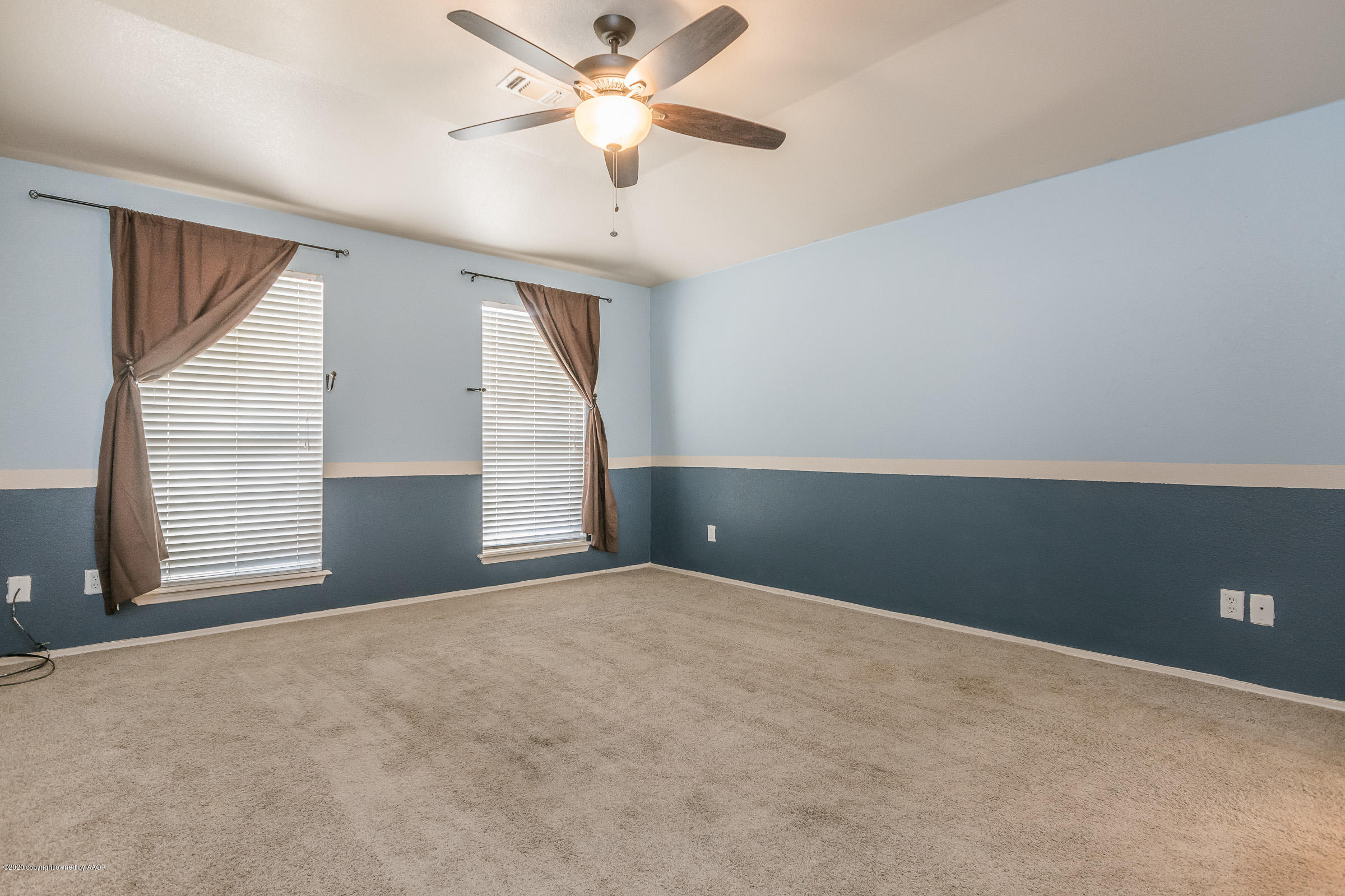 4812 Capulin Lane Amarillo, TX 79110 - Photo 9 of 20 a view of an empty room with a window