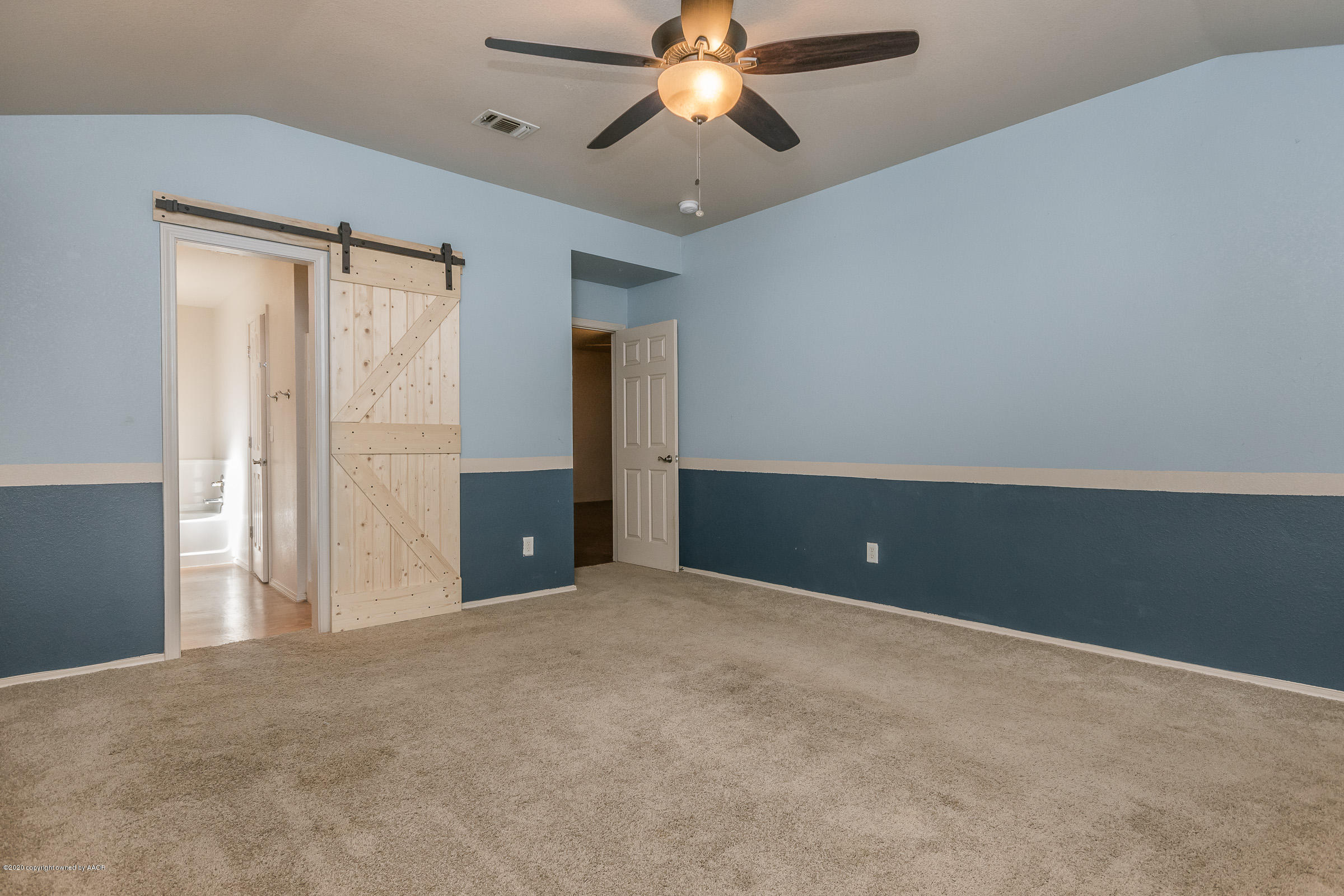 4812 Capulin Lane Amarillo, TX 79110 - Photo 10 of 20 a view of an empty room and chandelier fan