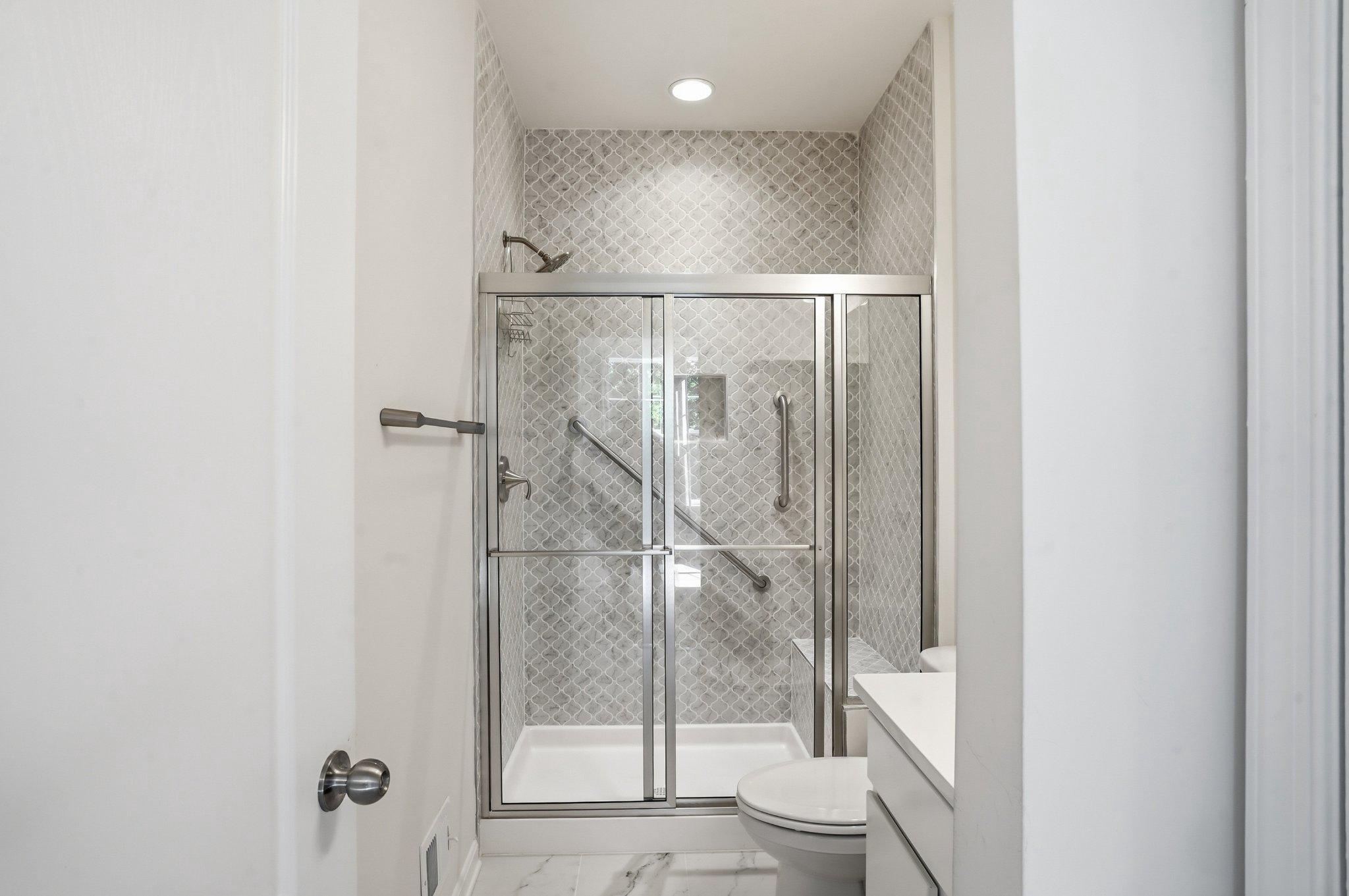 4755 South Polling House Road Harwood, MD 20776 - Photo 11 of 36 Sleek modern 2nd primary bath with elegant tiles.