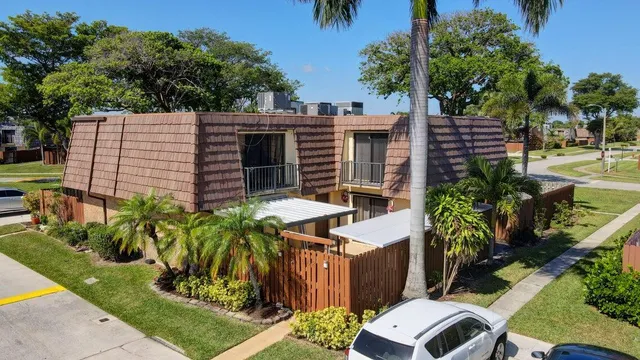 a view of an outdoor sitting area with brick walls