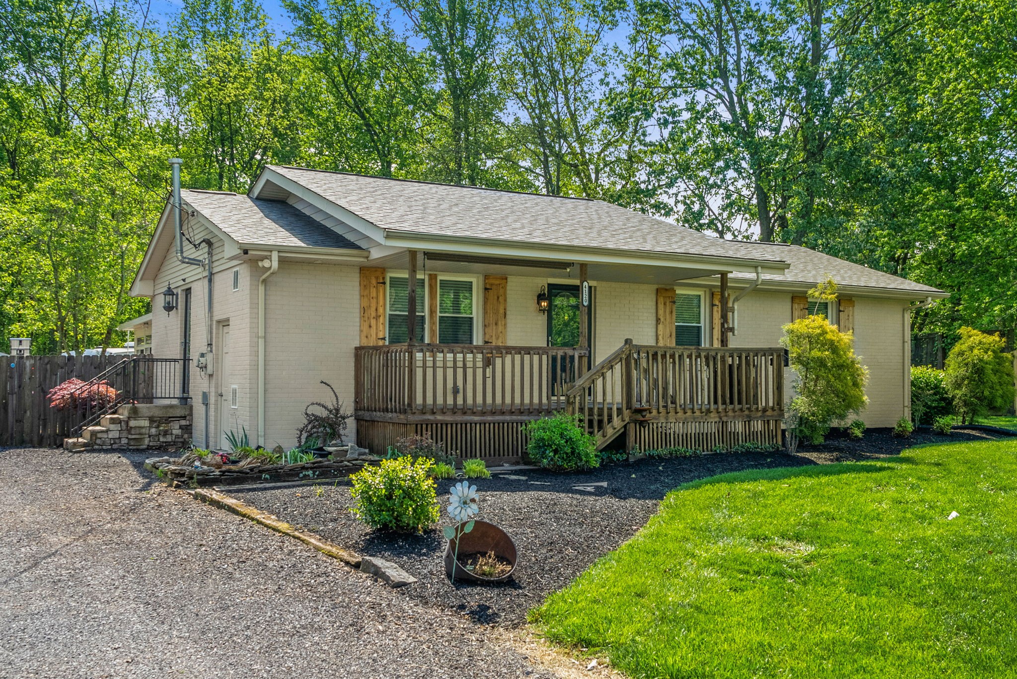 a view of a house with a yard and plants