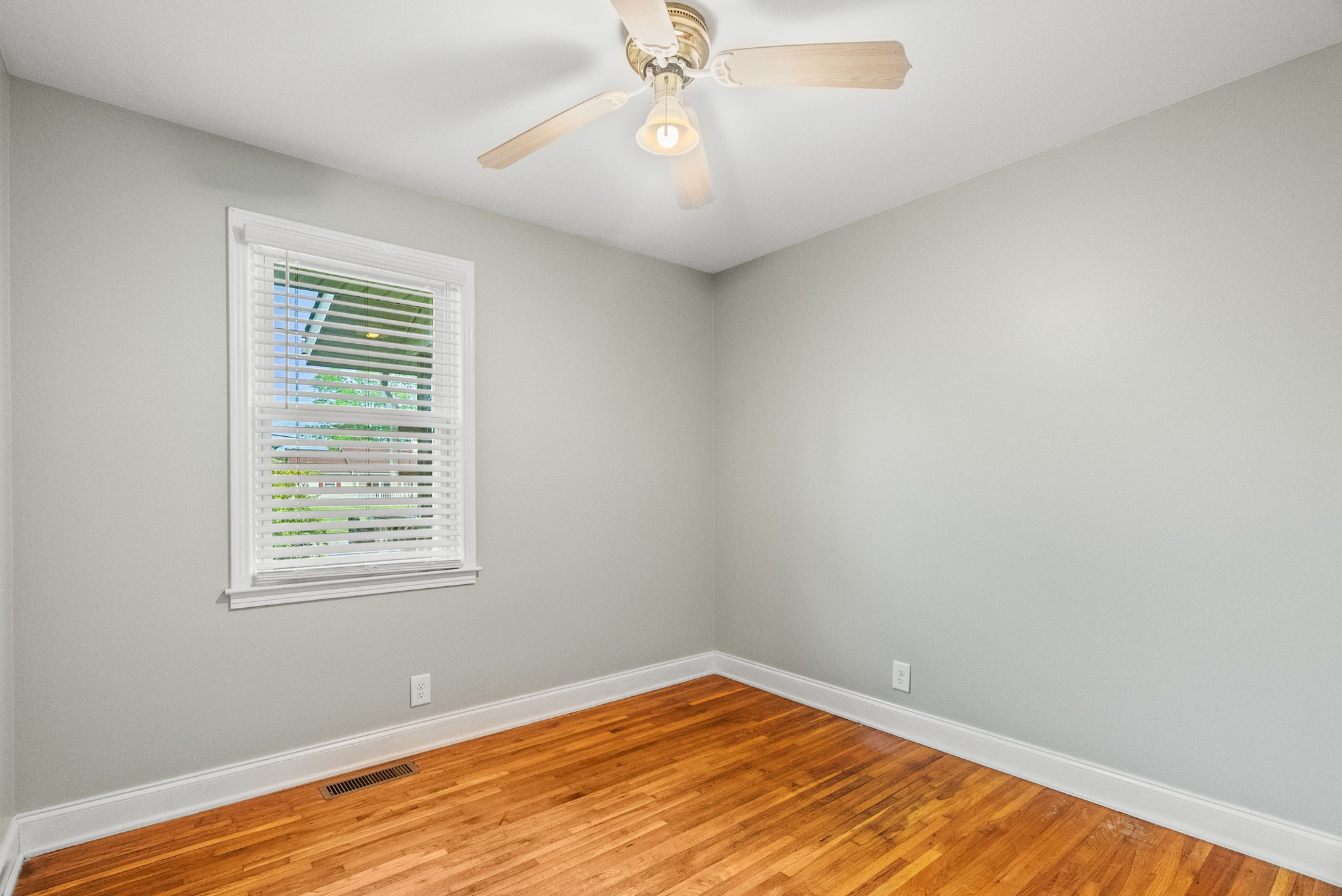 4120 Sycamore Road Greenbrier, TN 37073 - Photo 14 of 31 a view of an empty room with wooden floor and a window