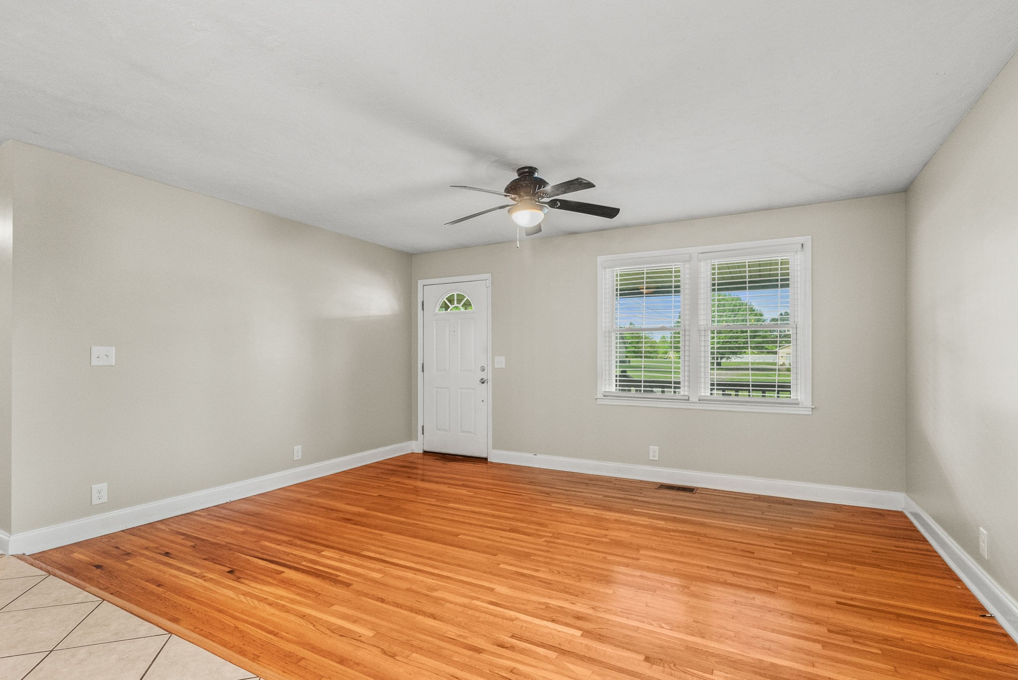 4120 Sycamore Road Greenbrier, TN 37073 - Photo 7 of 31 a view of an empty room with wooden floor and a window