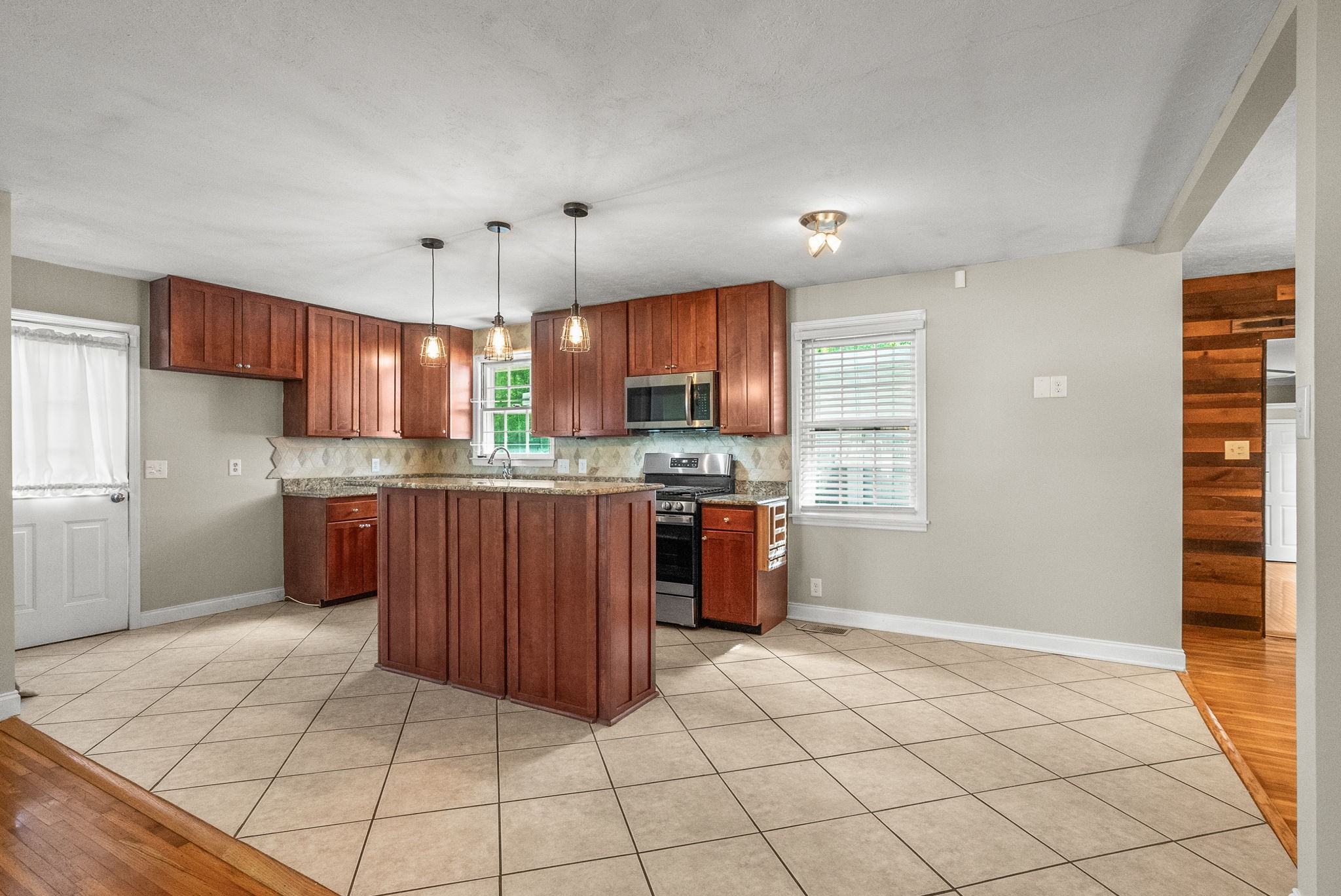 4120 Sycamore Road Greenbrier, TN 37073 - Photo 8 of 31 a kitchen with stainless steel appliances granite countertop a stove a sink and a refrigerator