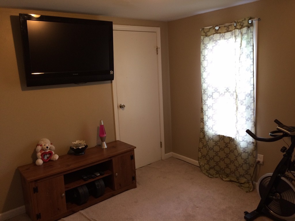 106 Surrey Road Springfield, MA 01118 - Photo 26 of 30 a room with a flat screen tv and a window