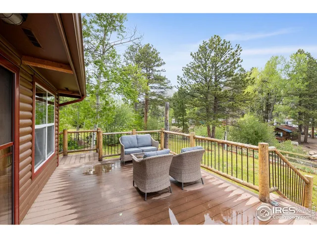 a view of a chair and table on the wooden floor