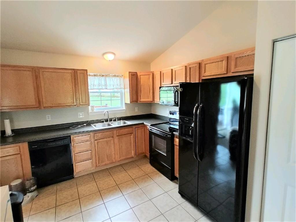 179 South Benbrook Road Butler, PA 16001 - Photo 3 of 21 a kitchen with granite countertop a refrigerator and a stove top oven