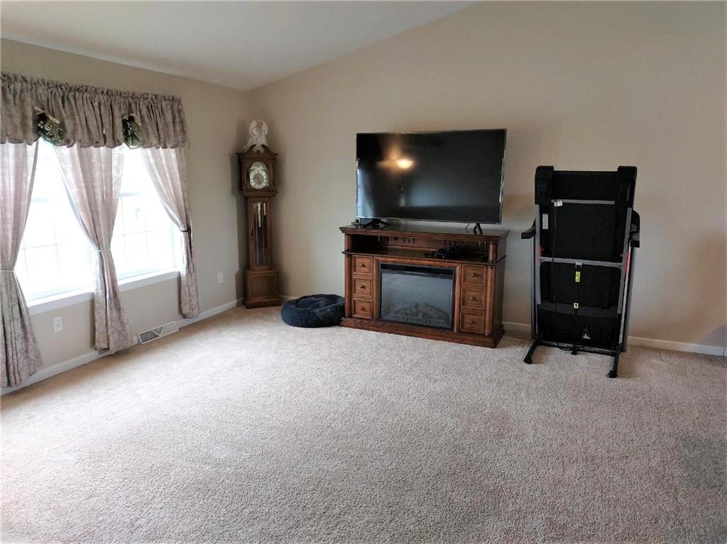 179 South Benbrook Road Butler, PA 16001 - Photo 5 of 21 a living room with furniture and a flat screen tv