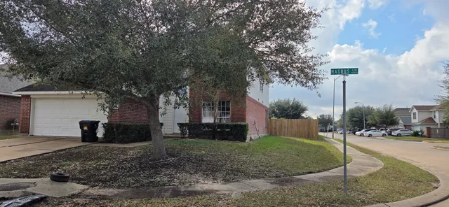 a view of a house with a yard